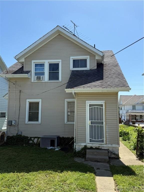 1080 Linden Ave, Dayton, OH 45410 - rear view of property with a lawn, entry steps, a shingled roof, and cooling unit