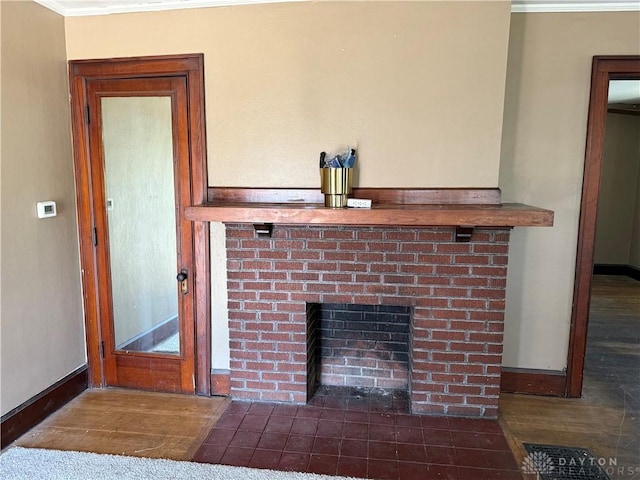1080 Linden Ave, Dayton, OH 45410 - detailed view of crown molding, baseboards, a fireplace, and wood finished floors