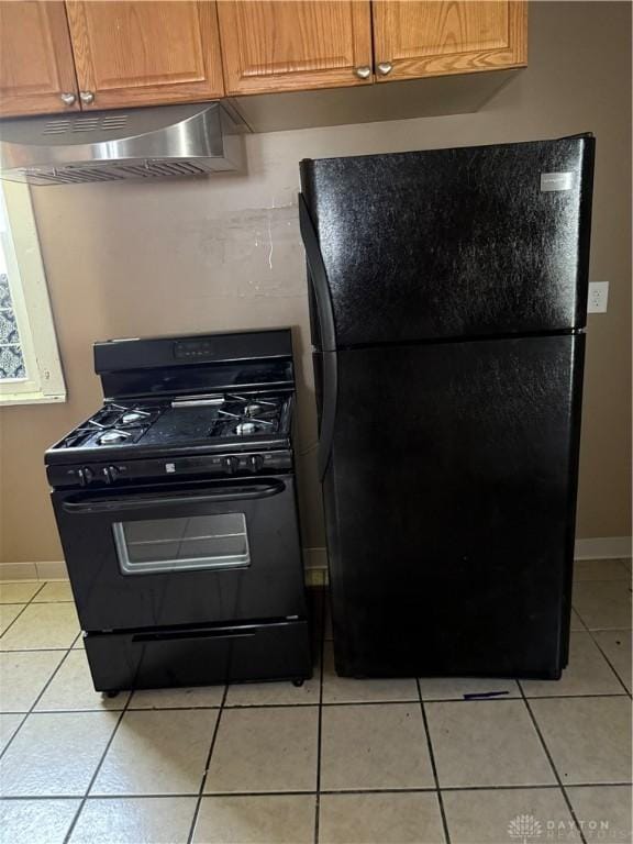 1080 Linden Ave, Dayton, OH 45410 - kitchen featuring black appliances, exhaust hood, light tile patterned flooring, and baseboards