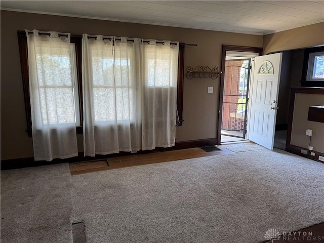 1080 Linden Ave, Dayton, OH 45410 - foyer entrance featuring crown molding, carpet, and baseboards