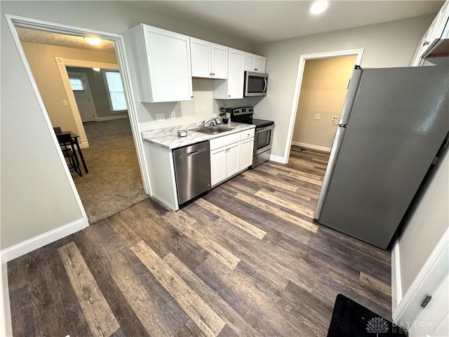 308 Park Ave, Harrison Twp, OH 45030 - kitchen featuring light countertops, appliances with stainless steel finishes, and white cabinets