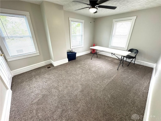 308 Park Ave, Harrison Twp, OH 45030 - interior space with a ceiling fan, a textured ceiling, visible vents, baseboards, and dark carpet