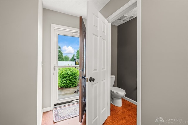 2750 Twin Lakes Dr, Troy, OH 45373 - bathroom featuring toilet, wood finished floors, and baseboards