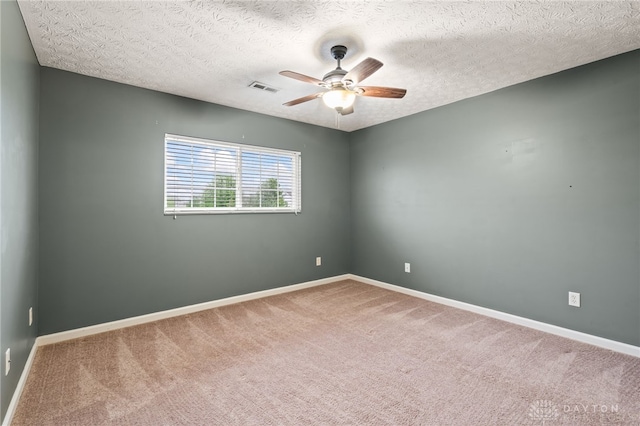 2750 Twin Lakes Dr, Troy, OH 45373 - carpeted spare room featuring ceiling fan, a textured ceiling, and baseboards
