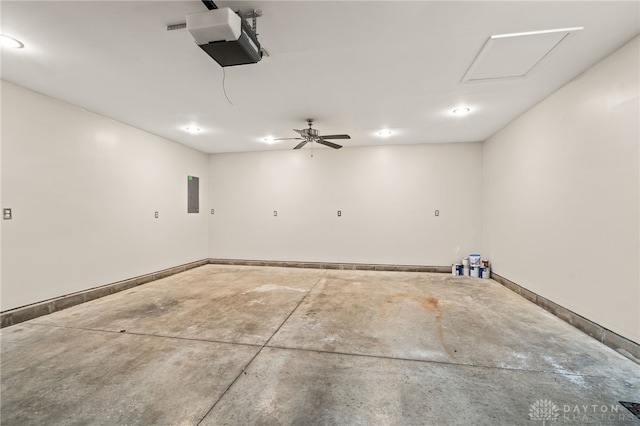 2750 Twin Lakes Dr, Troy, OH 45373 - garage featuring electric panel, a garage door opener, and baseboards