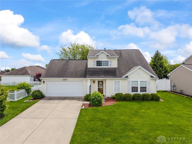 2750 Twin Lakes Dr, Troy, OH 45373 - view of front facade featuring a garage and concrete driveway