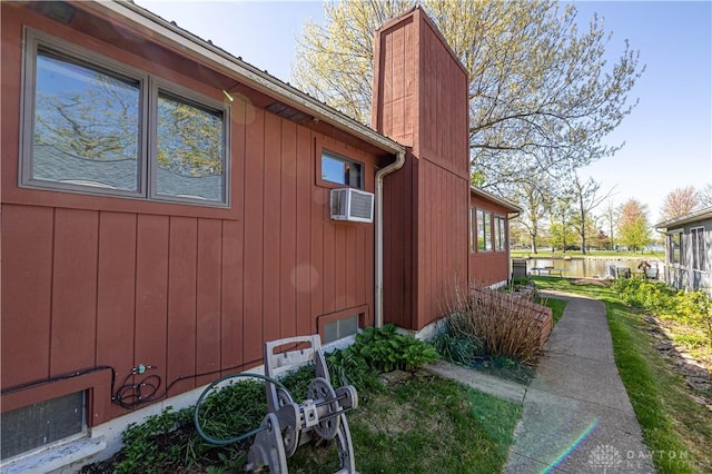 10125 Seminole Shore Dr, Huntsville, OH 43324 - view of property exterior featuring a chimney