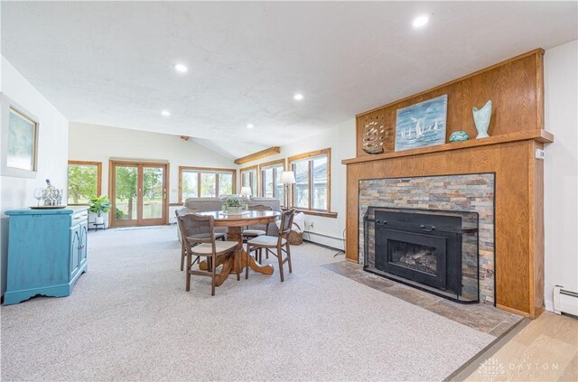 10125 Seminole Shore Dr, Huntsville, OH 43324 - dining space with baseboards, lofted ceiling, a baseboard radiator, and recessed lighting
