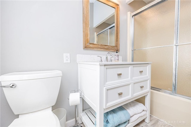 10125 Seminole Shore Dr, Huntsville, OH 43324 - full bathroom with baseboard heating, toilet, vanity, and combined bath / shower with glass door
