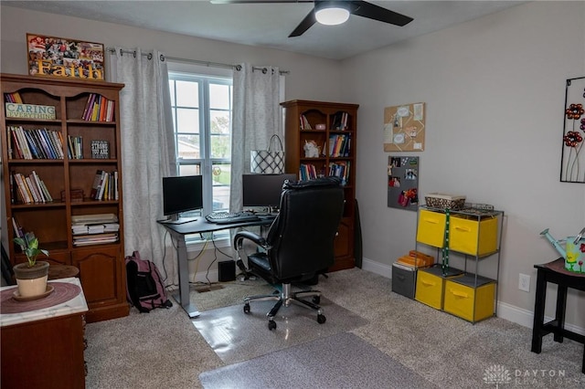 office featuring baseboards, ceiling fan, and carpet floors