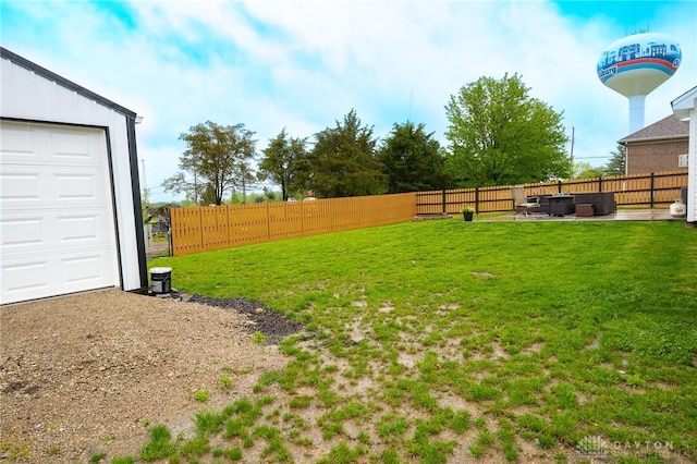 view of yard with a fenced backyard, a patio, and outdoor lounge area