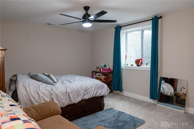 bedroom with visible vents, carpet, ceiling fan, and baseboards