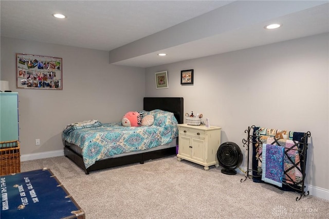bedroom with recessed lighting, baseboards, and light carpet