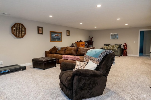 carpeted living room with baseboards, recessed lighting, and visible vents