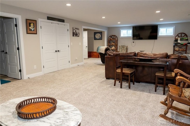 living area featuring carpet flooring, recessed lighting, and a healthy amount of sunlight