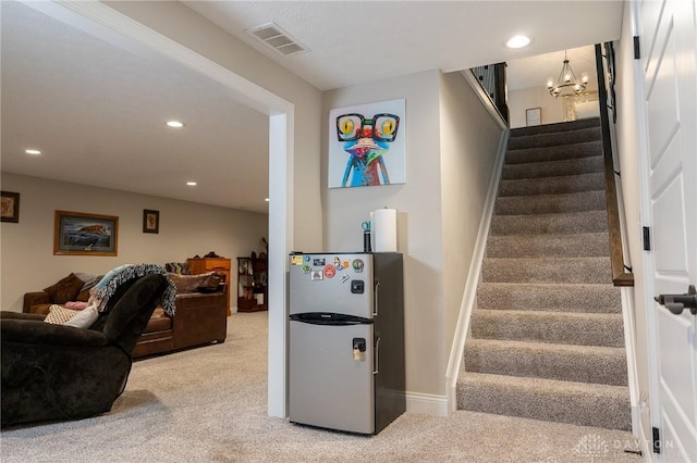 staircase featuring baseboards, carpet flooring, recessed lighting, and visible vents