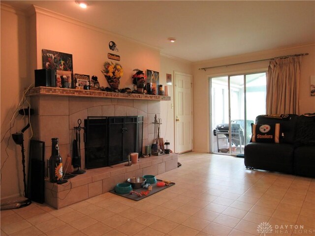 living area featuring ornamental molding and a fireplace
