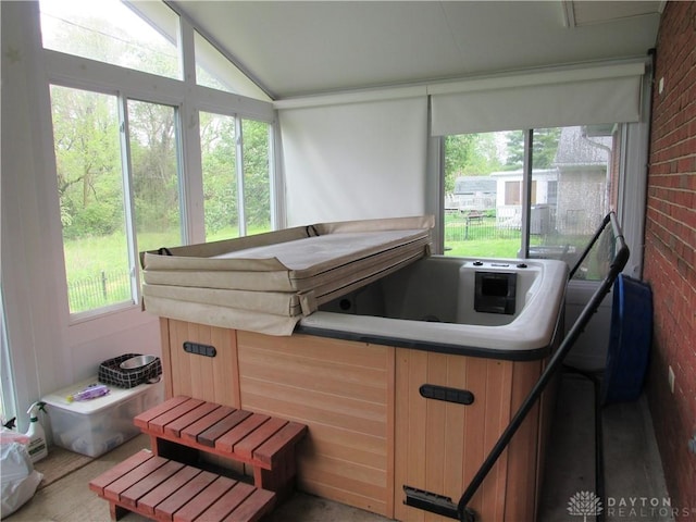 sunroom featuring a hot tub