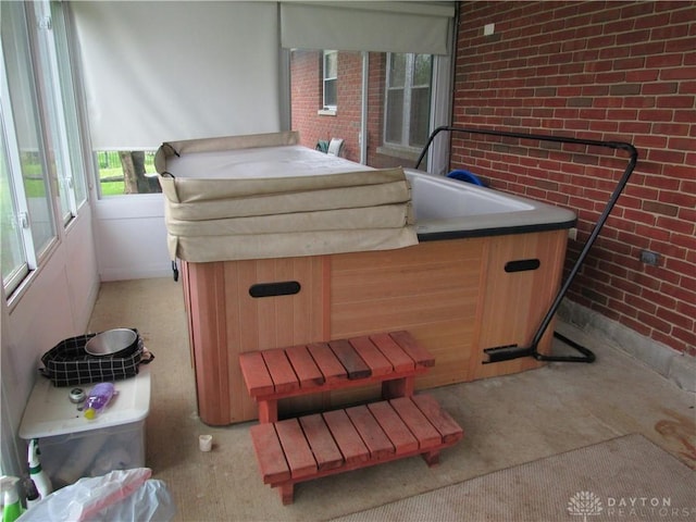 view of patio / terrace with an indoor hot tub