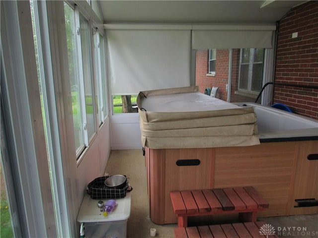 sunroom with a jacuzzi
