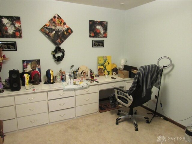 office area featuring light carpet