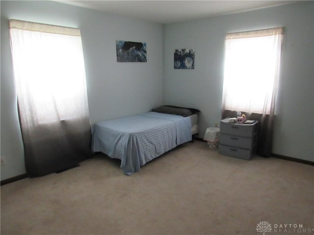 bedroom with light carpet