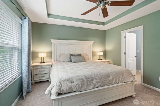 4266 Straight Arrow Rd, Beavercreek, OH 45430 - carpeted bedroom with baseboards, ceiling fan, and a tray ceiling