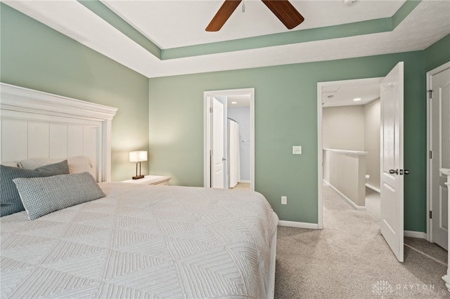 4266 Straight Arrow Rd, Beavercreek, OH 45430 - bedroom with carpet flooring, a ceiling fan, a tray ceiling, and baseboards