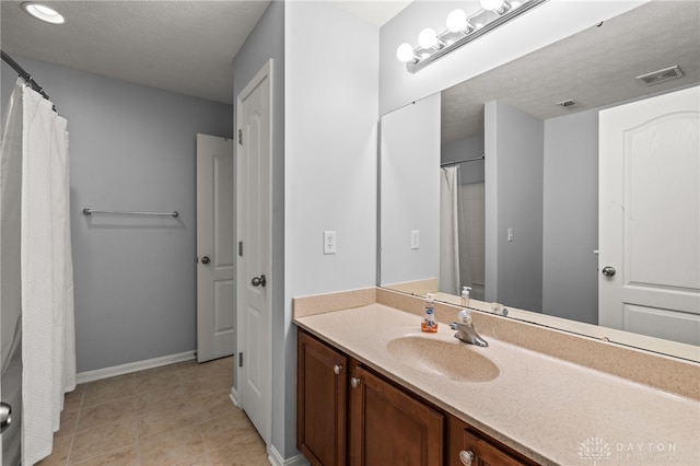 4266 Straight Arrow Rd, Beavercreek, OH 45430 - bathroom with baseboards, visible vents, tile patterned floors, and vanity