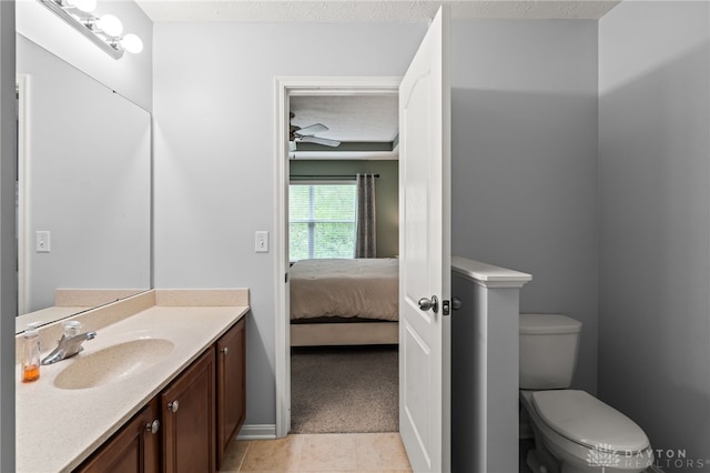 4266 Straight Arrow Rd, Beavercreek, OH 45430 - bathroom with tile patterned flooring, ensuite bath, vanity, toilet, and baseboards