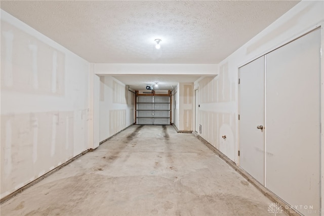 4266 Straight Arrow Rd, Beavercreek, OH 45430 - interior space featuring a textured ceiling and a garage
