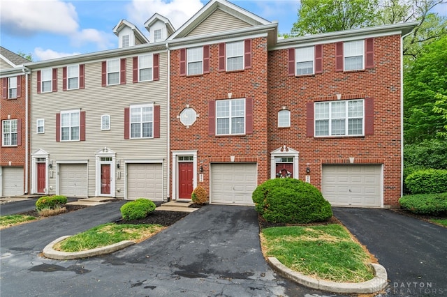 4266 Straight Arrow Rd, Beavercreek, OH 45430 - multi unit property with an attached garage, driveway, and brick siding