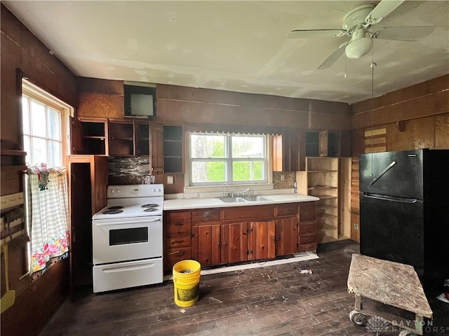 kitchen featuring freestanding refrigerator, white range with electric stovetop, ceiling fan, light countertops, and dark wood-style floors