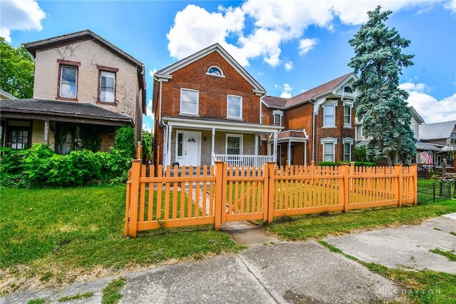 221 Linden Ave, Dayton, OH 45403 - view of front of property with covered porch, a fenced front yard, a gate, and a front lawn