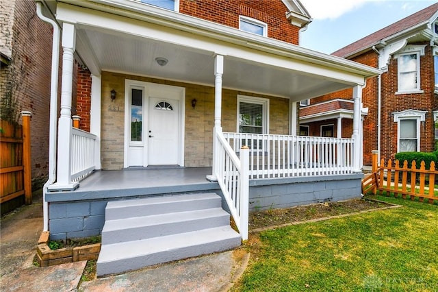 221 Linden Ave, Dayton, OH 45403 - view of exterior entry featuring covered porch and fence