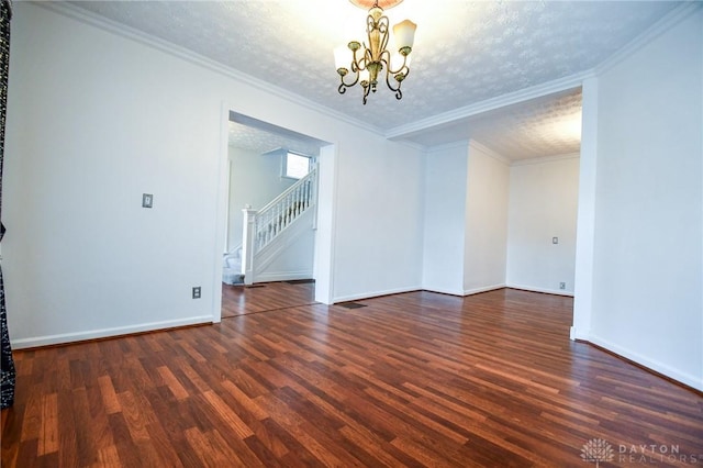 221 Linden Ave, Dayton, OH 45403 - empty room with stairway, an inviting chandelier, baseboards, and wood finished floors