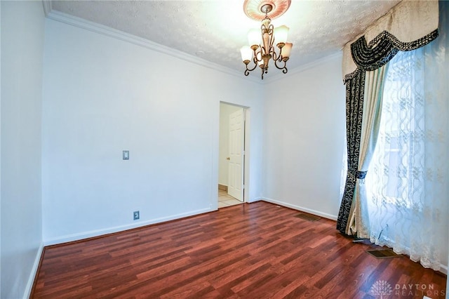 221 Linden Ave, Dayton, OH 45403 - spare room with an inviting chandelier, wood finished floors, baseboards, and crown molding