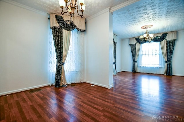 221 Linden Ave, Dayton, OH 45403 - empty room with a notable chandelier, crown molding, a textured ceiling, and wood finished floors