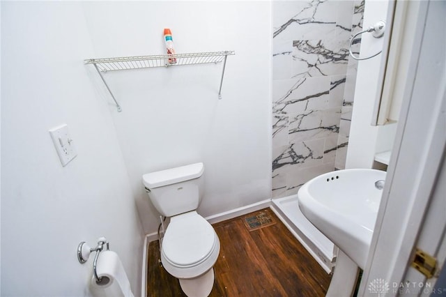 221 Linden Ave, Dayton, OH 45403 - full bathroom with toilet, wood finished floors, a sink, baseboards, and a shower stall