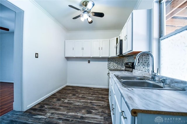 221 Linden Ave, Dayton, OH 45403 - kitchen featuring a ceiling fan, ornamental molding, a sink, white cabinetry, and dark wood-style floors