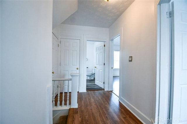 221 Linden Ave, Dayton, OH 45403 - hallway with baseboards, an upstairs landing, and wood finished floors