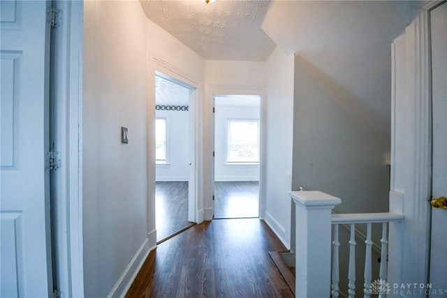 221 Linden Ave, Dayton, OH 45403 - corridor with a textured ceiling, baseboards, dark wood-style floors, and an upstairs landing