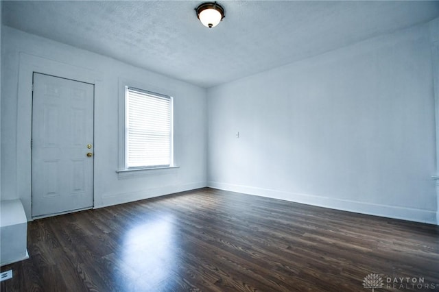221 Linden Ave, Dayton, OH 45403 - interior space featuring a textured ceiling, baseboards, and dark wood-type flooring