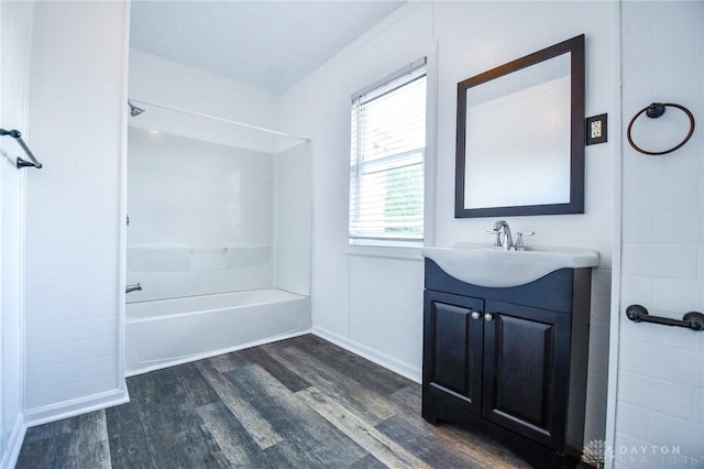 221 Linden Ave, Dayton, OH 45403 - full bath featuring baseboards, washtub / shower combination, vanity, and wood finished floors