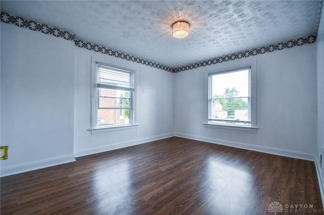 221 Linden Ave, Dayton, OH 45403 - unfurnished room featuring baseboards and dark wood finished floors