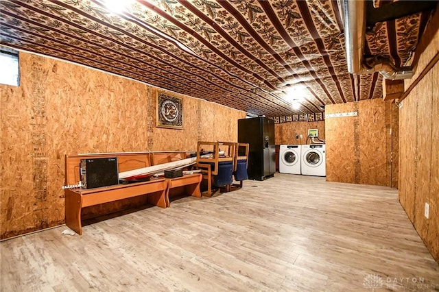 221 Linden Ave, Dayton, OH 45403 - interior space featuring washing machine and clothes dryer, wooden walls, laundry area, and wood finished floors