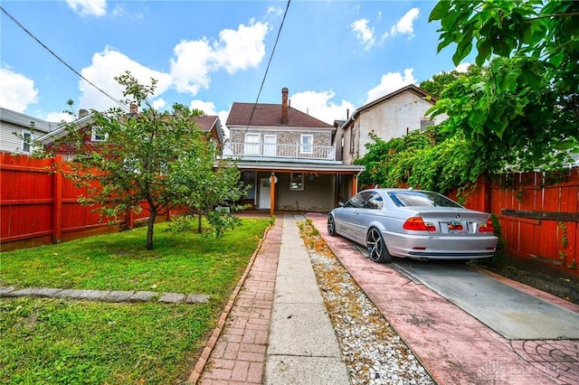 221 Linden Ave, Dayton, OH 45403 - rear view of house featuring a yard, a porch, fence, and a balcony