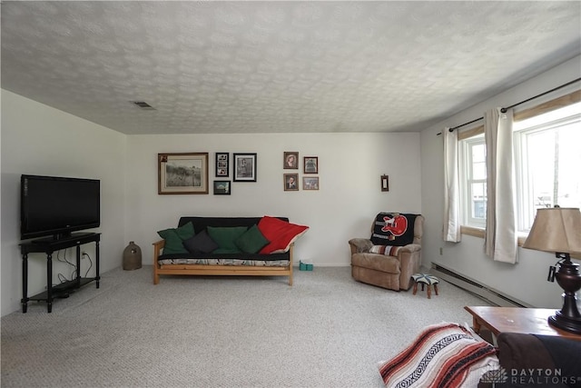 living room featuring a textured ceiling, baseboard heating, visible vents, and carpet floors