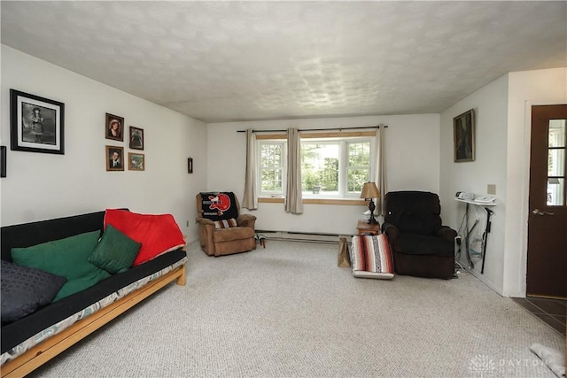carpeted living area with plenty of natural light, a baseboard radiator, and a textured ceiling