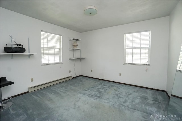 unfurnished room featuring baseboards, baseboard heating, and carpet